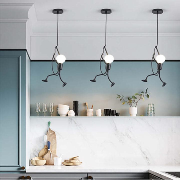 Modern kitchen with pendant lights hanging above a countertop.