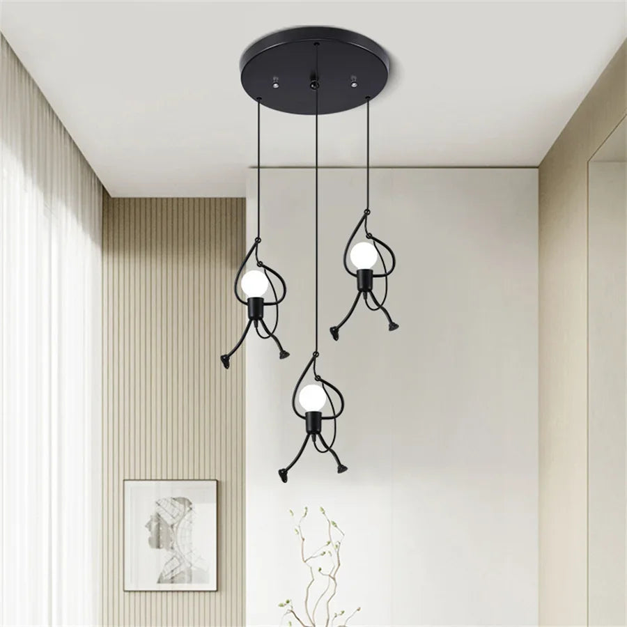 Modern pendant light fixture hanging from the ceiling in a room with neutral walls and decor.