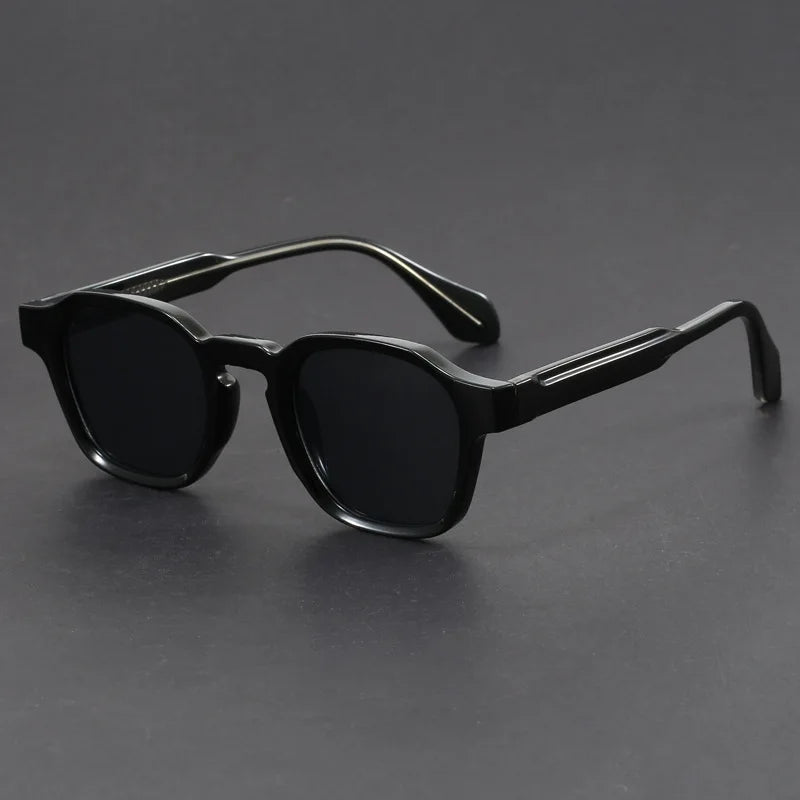 Black sunglasses on a gray background