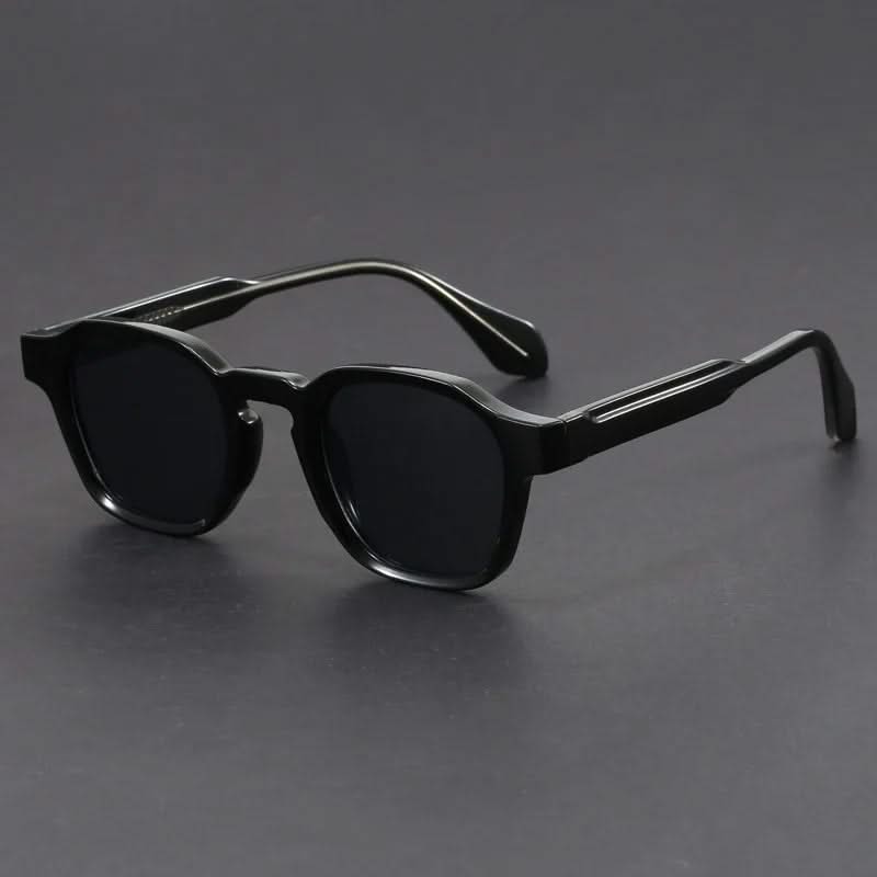 Black sunglasses on a gray background