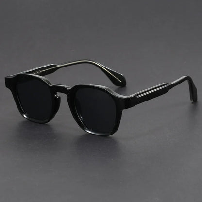 Black sunglasses on a gray background