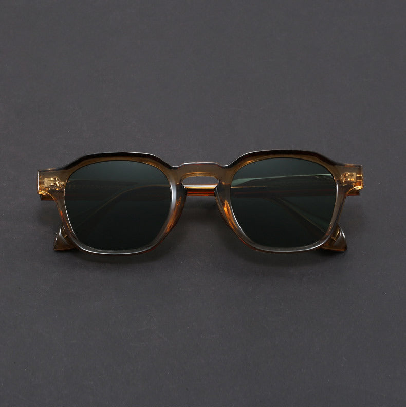 Sunglasses with a tortoiseshell frame on a gray background
