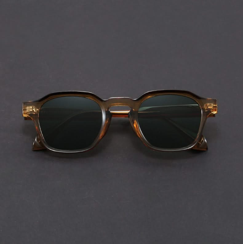 Sunglasses with a tortoiseshell frame on a gray background