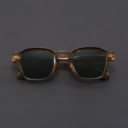 Sunglasses with a tortoiseshell frame on a gray background