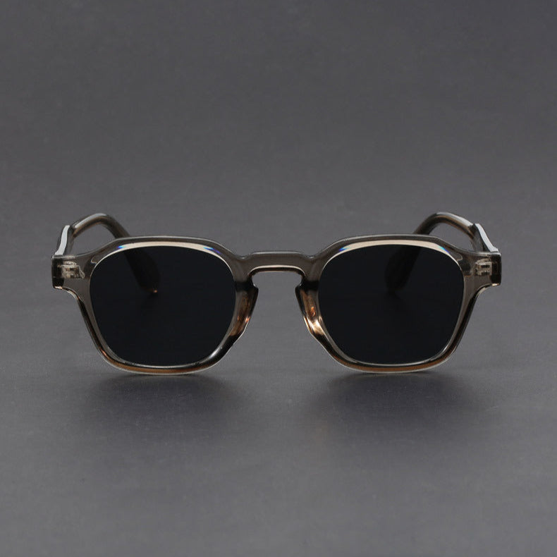 Sunglasses with a metallic frame on a gray background