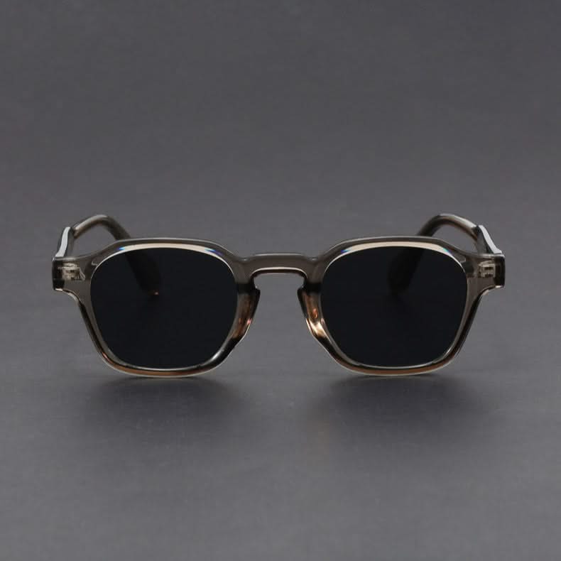 Sunglasses with a metallic frame on a gray background