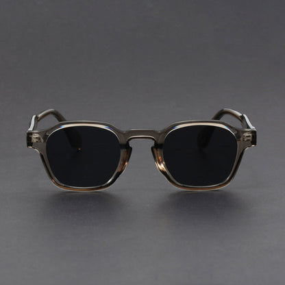 Sunglasses with a metallic frame on a gray background