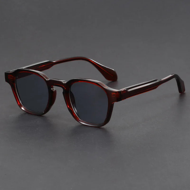 Brown sunglasses on a gray background
