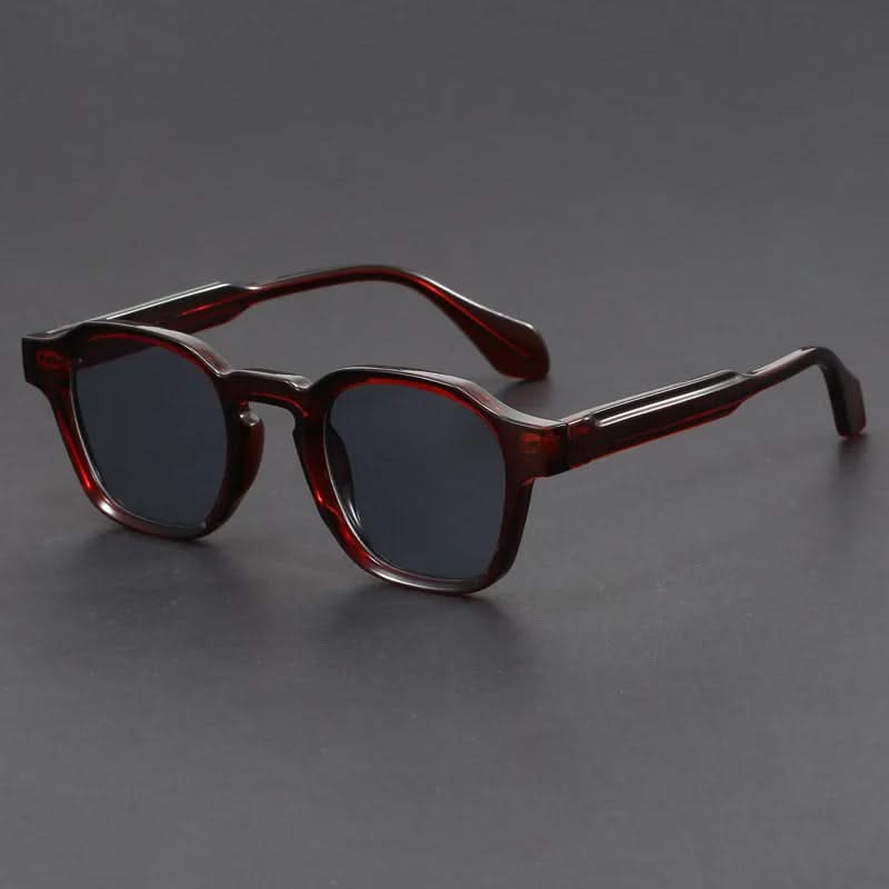 Brown sunglasses on a gray background