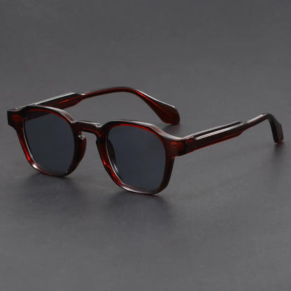Brown sunglasses on a gray background