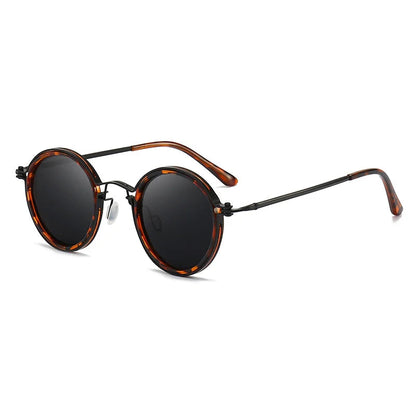 Round sunglasses with tortoiseshell frame and dark lenses on a white background
