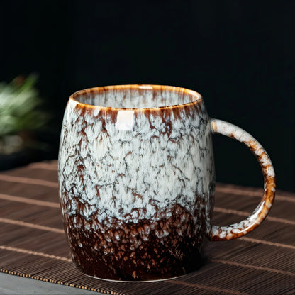 Ceramic mug with marbled design on a dark background