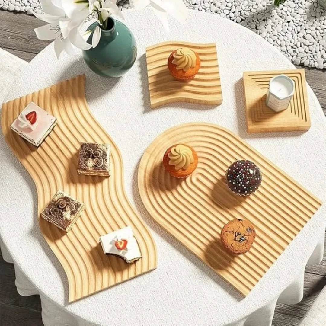 Josh & Tate - Ripple Wave Wooden Serving Tray - Wooden serving trays with assorted pastries on a white tablecloth.