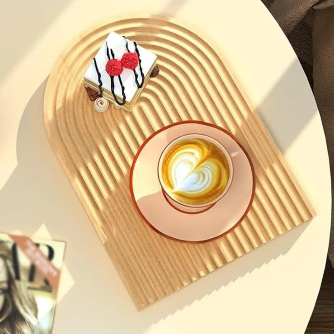 Josh & Tate - Ripple Wave Wooden Serving Tray - Cup of coffee with latte art and a small cake on a textured surface.