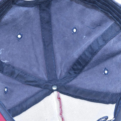 Josh & Tate - RockShank™ 1969 Baseball Cap - Close-up of a blue umbrella with visible wear and tear.