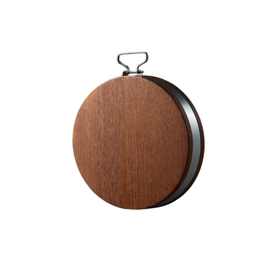 Wooden circular object with a metal handle on a white background