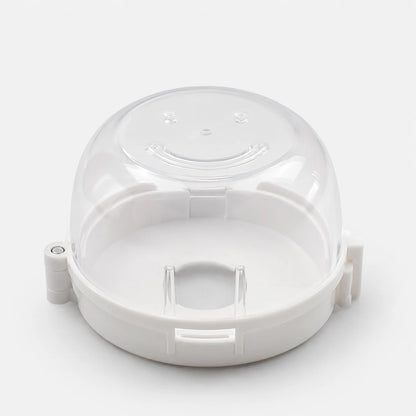 Josh & Tate - SafeKnob™ Child Safety Stove Covers - A clear plastic dome lid with a white base, designed as a replacement part, shown on a light gray background.