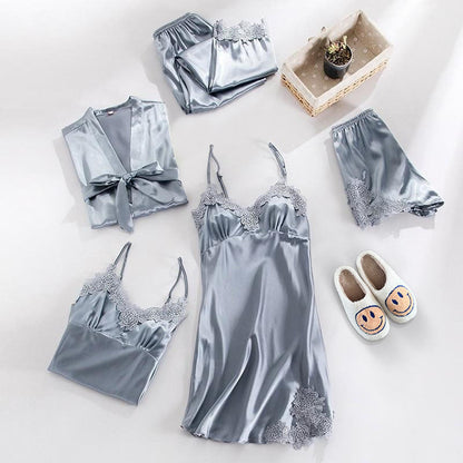 Silver satin pajama set with matching robe and slippers on a white background