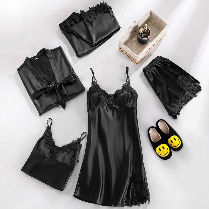 Black lace lingerie set with matching robe, shorts, and slippers on a light background