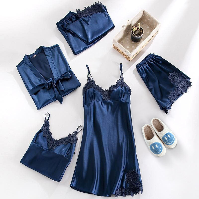 Blue satin lingerie set with matching robe and slippers on a white background