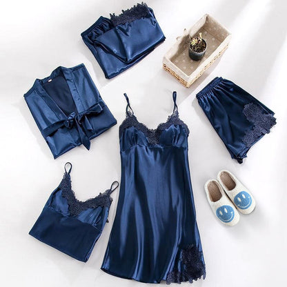 Blue satin lingerie set with matching robe and slippers on a white background