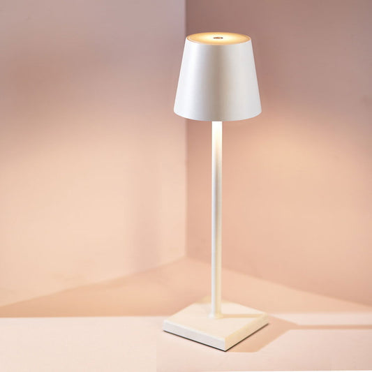 White floor lamp with a soft glow on a neutral background