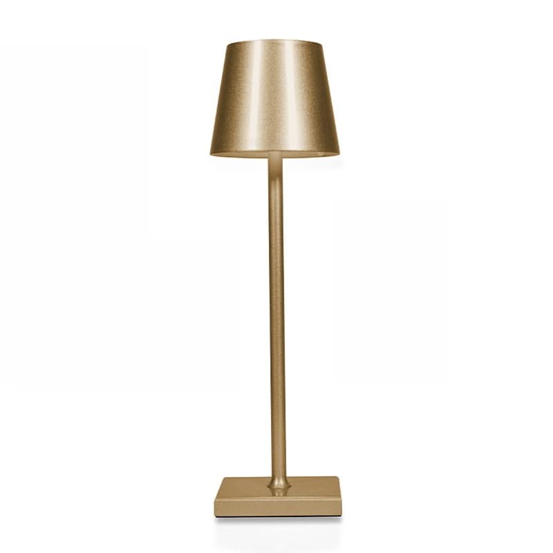 Gold table lamp on a white background