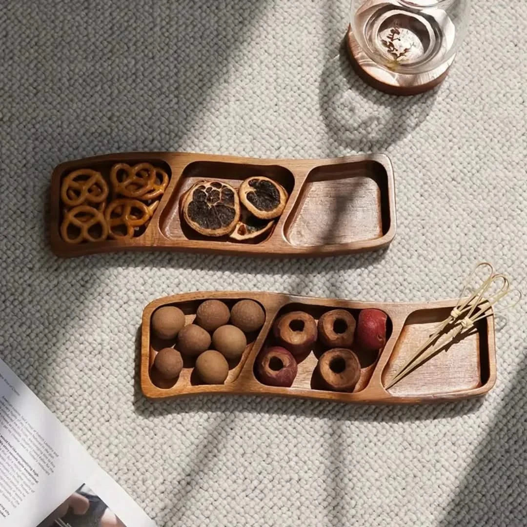 Josh & Tate - Sectioned Wooden Serving Tray - Two wooden snack platters with various treats on a textured surface.