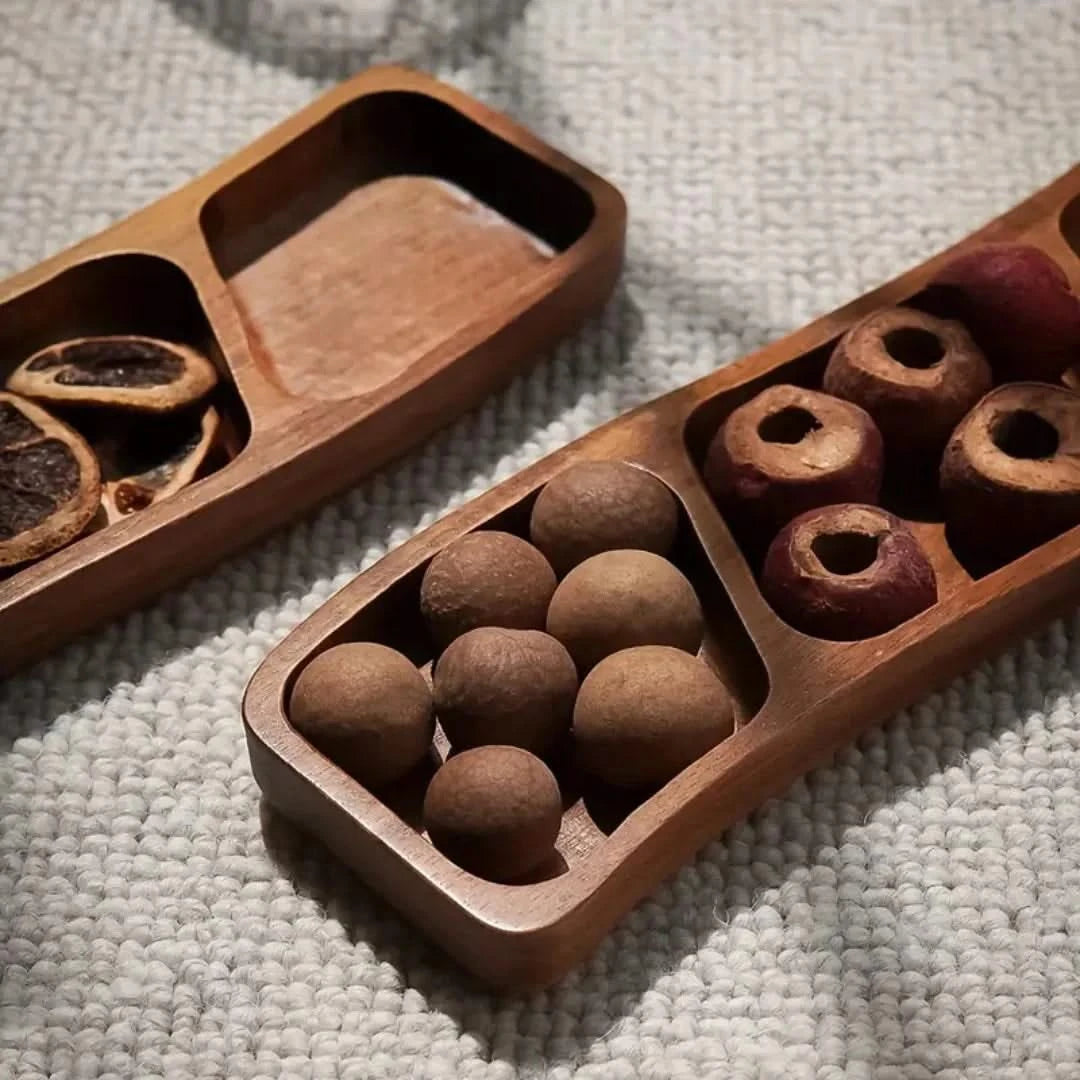 Josh & Tate - Sectioned Wooden Serving Tray - Wooden puzzle game with spherical and cylindrical pieces on a textured surface