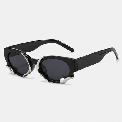 Josh & Tate - SerpentEdge™ Statement Sunglasses - Black cat-eye sunglasses with dark lenses and silver metal accents on the temples, shown on a light gray background.