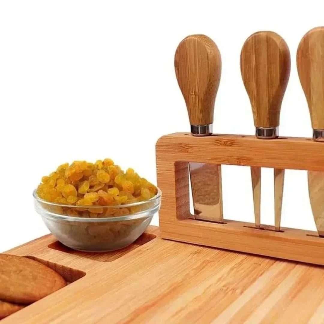Josh & Tate - Serving Board Set with Built-In Knife Holder - Bowl of raisins next to a set of wooden knives in a holder on a wooden surface.