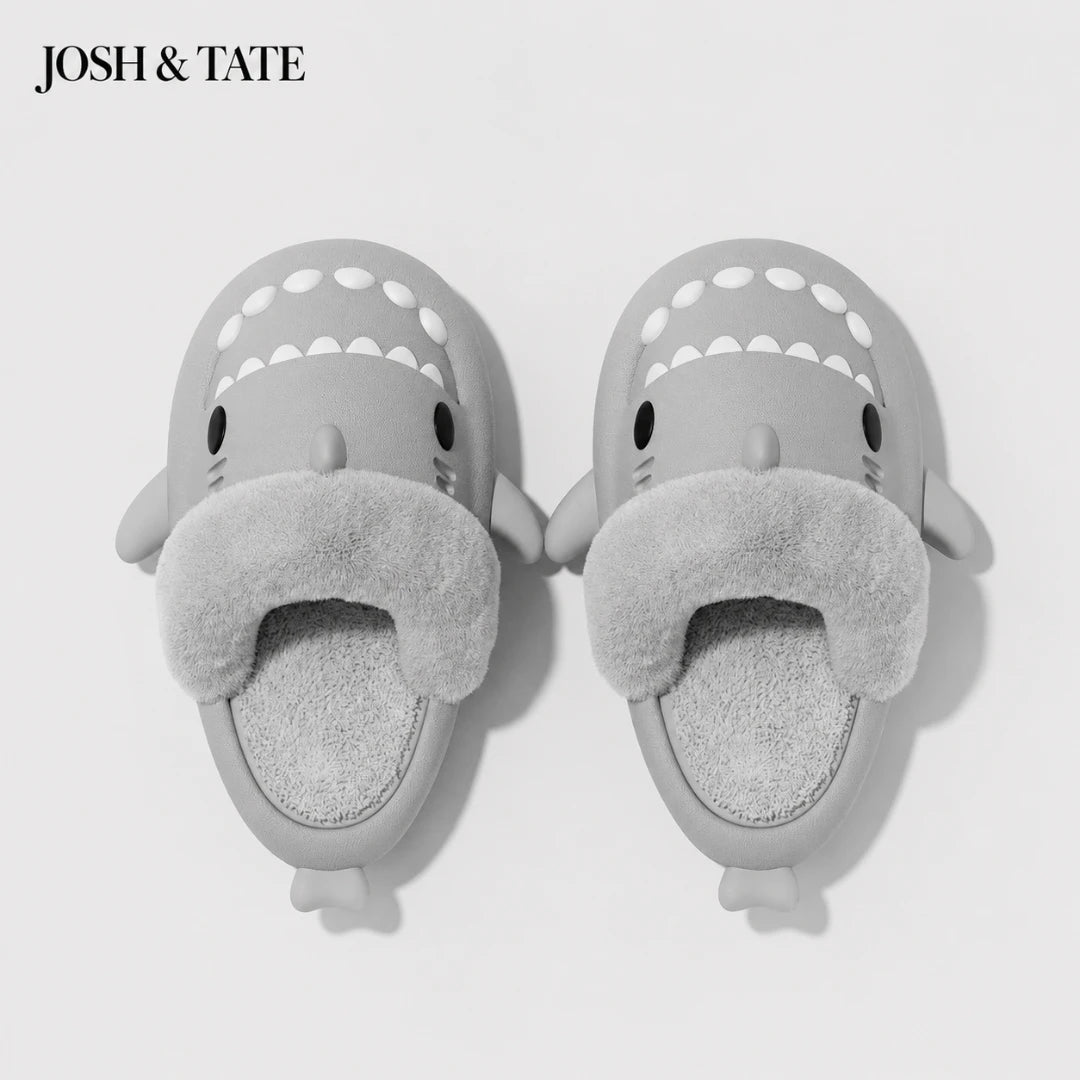 Josh & Tate - SharkStep™ Plush Slip-On Slipper - Gray shark-shaped slippers with fuzzy texture on a white background, branded 'JOSH & TATE'.