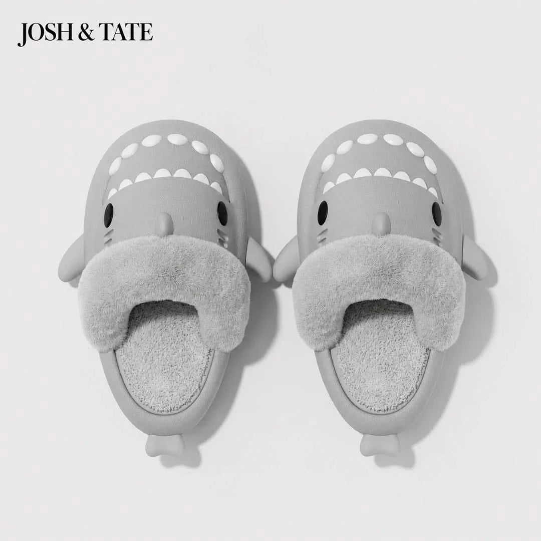 Josh & Tate - SharkStep™ Plush Slip-On Slipper - Gray shark-shaped slippers with fuzzy texture on a white background, branded 'JOSH & TATE'.