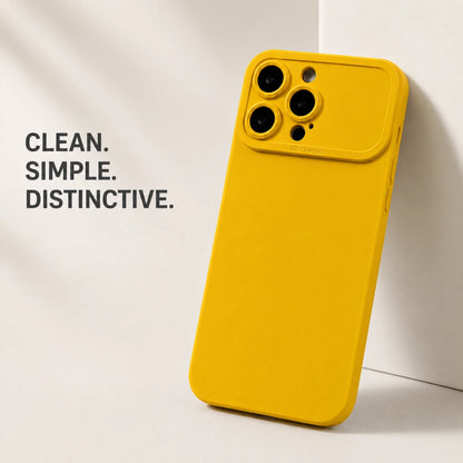 Josh & Tate - ShockProof™ iPhone Case - A bright yellow protective phone case with a distinctive raised camera bumper, shown standing upright against a clean white background with soft shadows. The text 'CLEAN.