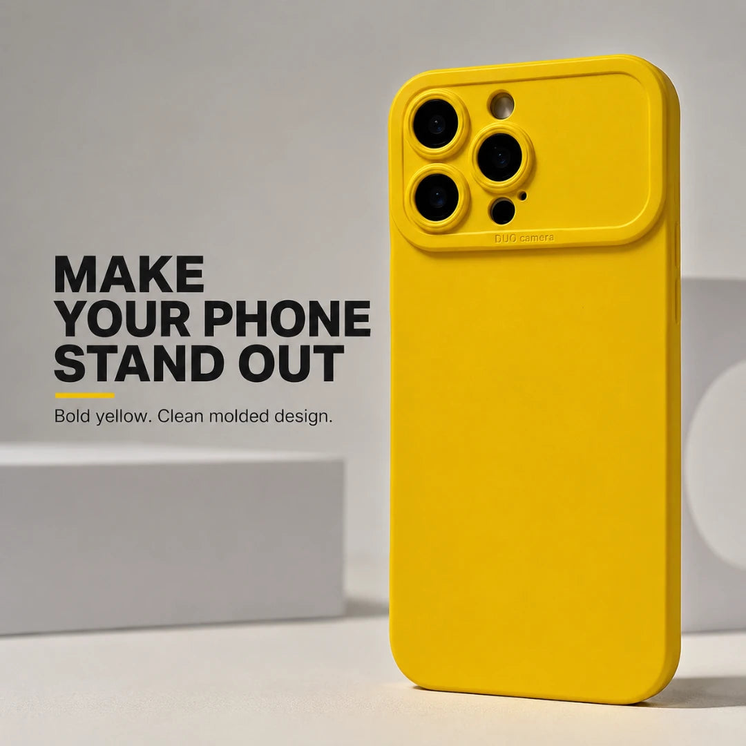 Josh & Tate - ShockProof™ iPhone Case - A bright yellow protective phone case with a raised camera bar, shown standing upright on a light gray surface next to text that reads 'MAKE YOUR PHONE STAND OUT Bold yellow. Clean molded design.