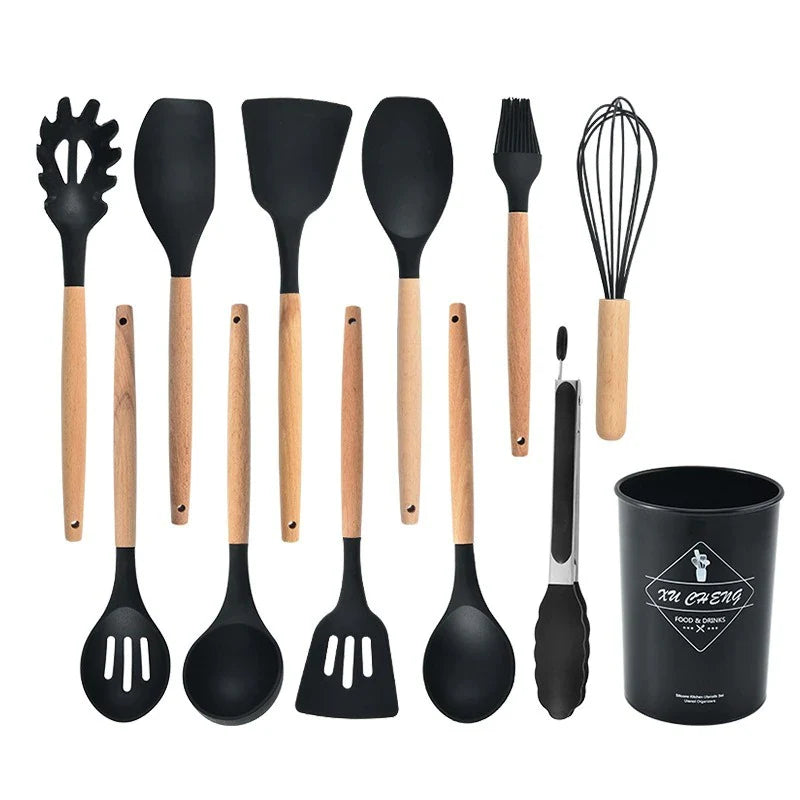 Set of black kitchen utensils with wooden handles on a white background