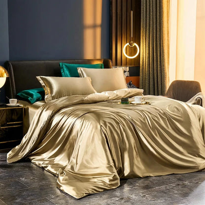 Gold satin bedding set on a bed in a stylish bedroom with modern decor.