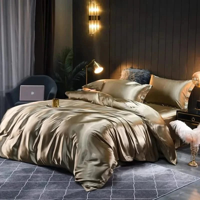 Luxurious bedroom with satin bedding, lamp, and decor.