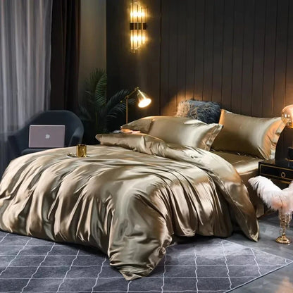 Luxurious bedroom with satin bedding, lamp, and decor.