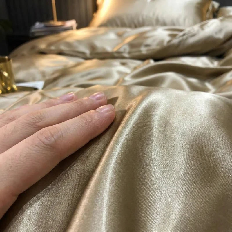 Hand touching a gold satin fabric surface