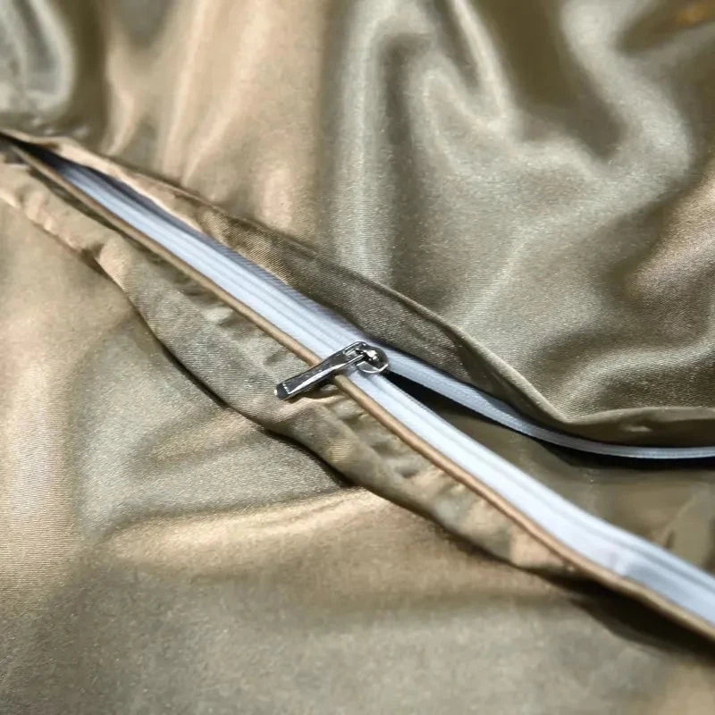 Close-up of a gold satin fabric with a zipper