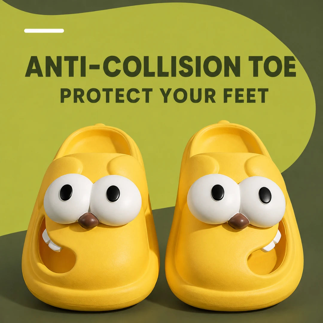 Josh & Tate - SnaggleToe™ Slides - A pair of bright yellow novelty slide sandals with oversized cartoon eyes, a small brown nose, and white teeth details, shown on a dark olive background with the text 'ANTI-COLLISION TOE PROTECT YOUR FEET'.
