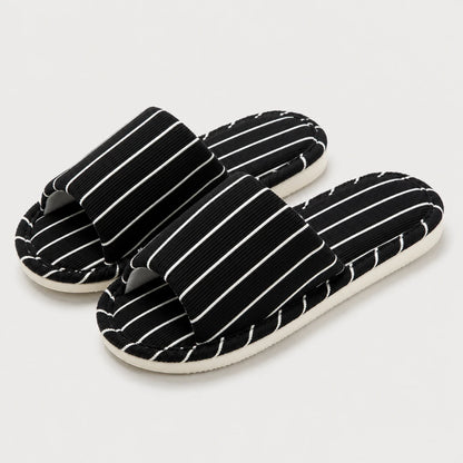 Josh & Tate - SoftStripe™ Cozy Home Slippers - A pair of black slide sandals with white vertical pinstripes on a light gray background.