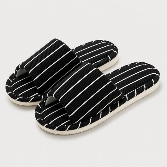 Josh & Tate - SoftStripe™ Cozy Home Slippers - A pair of black slide sandals with white vertical pinstripes on a light gray background.