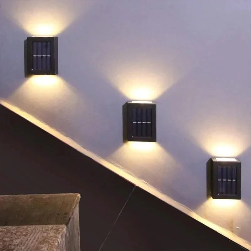 Josh & Tate - SolarGlow Wireless Wall Lamp - Three square wall lights on a white wall with a dark floor.