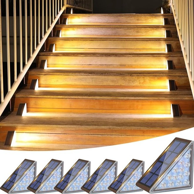 Wooden staircase with embedded solar lights on a white background