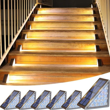 Wooden staircase with embedded solar lights on a white background