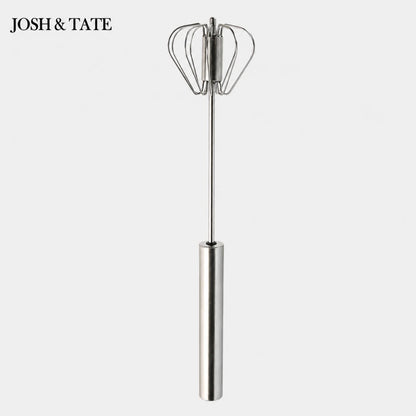 Josh & Tate - SpinWhisk™ Self-Rotating Hand Whisk - Metal whisk with balloon ends on a white background, branded 'Josh & Tate'.