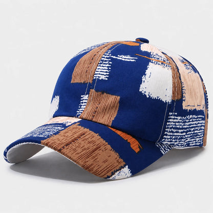 Josh & Tate - SplashPatch™ Graffiti Cap - A baseball cap with an abstract brushstroke pattern in navy blue, brown, beige, and white, shown on a light gray background.