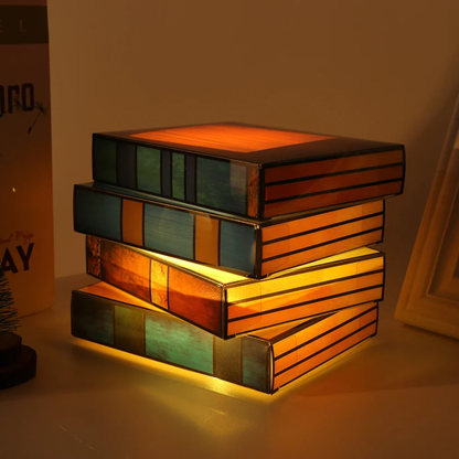 Stack of colorful rectangular blocks with a warm glow on a neutral background